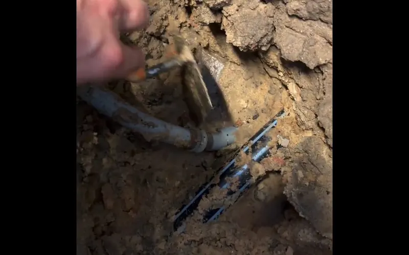 Close view of exposed pipe section being repaired after a water leak for 24 7 Emergency Plumbing service in Mechanicsburg