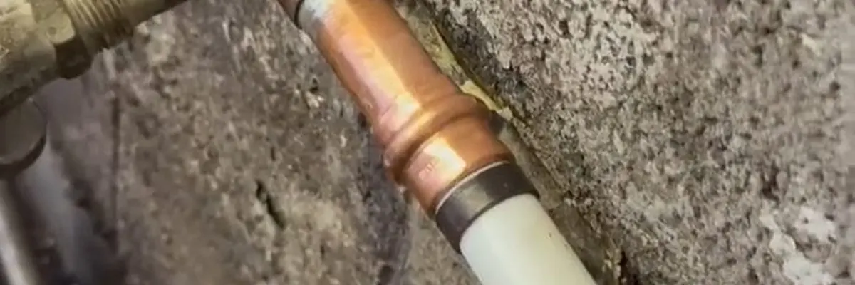 Wide view of exposed pipe section being repaired after a water leak for Burst Pipe Repair service in Mechanicsburg