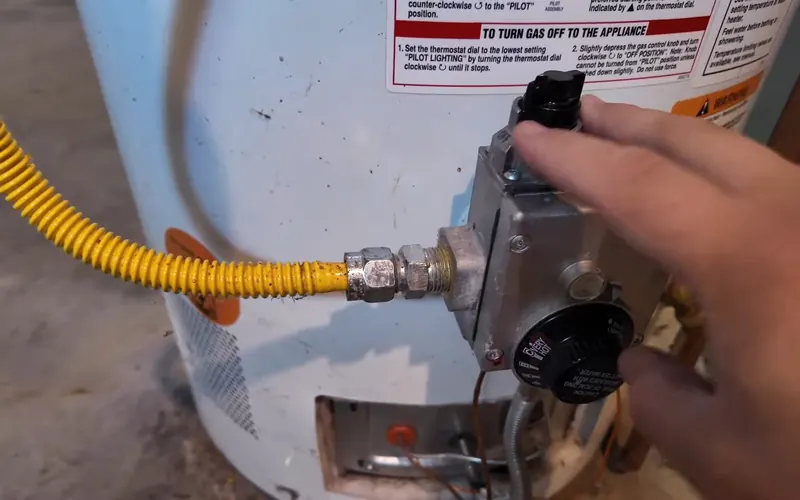 Close view of gas line valve and appliance connection being serviced for Gas Line Repair Installation service in Mechanicsburg