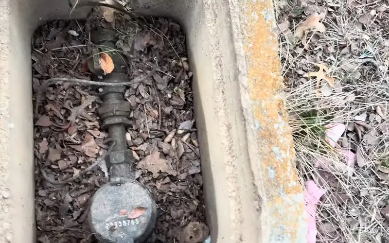 Close view of outdoor hose bib connection being repaired near the wall for Hose Bib Repair Replacement service in Mechanicsburg